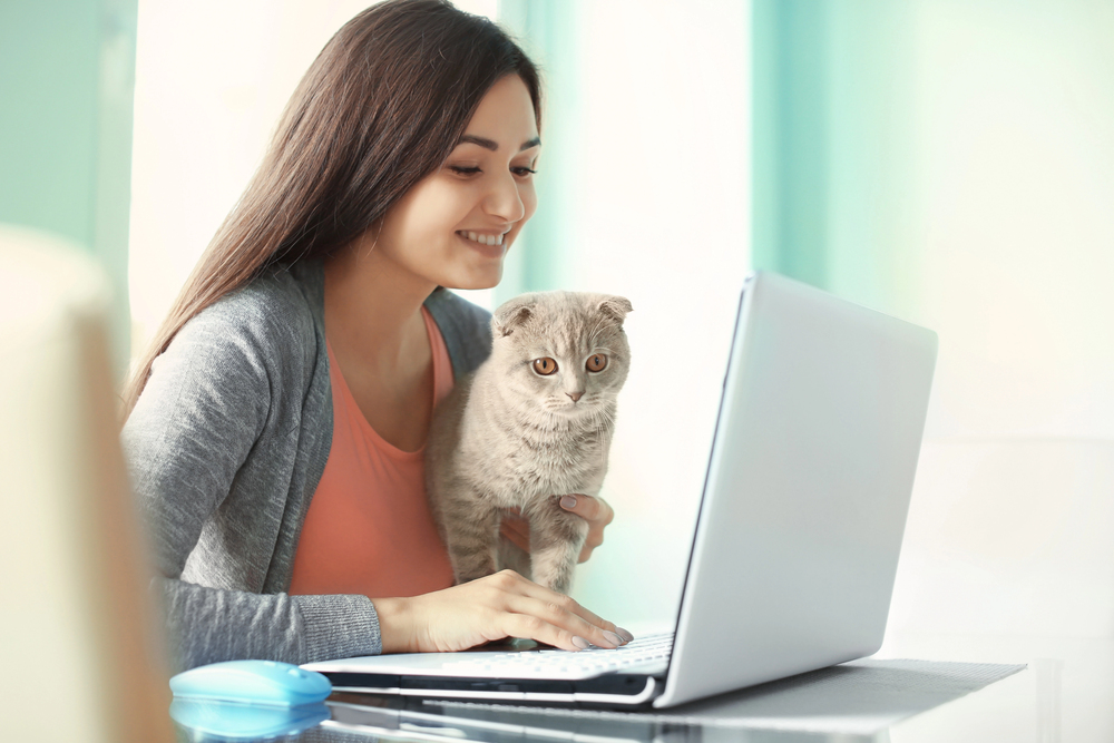 Young woman with cute cat